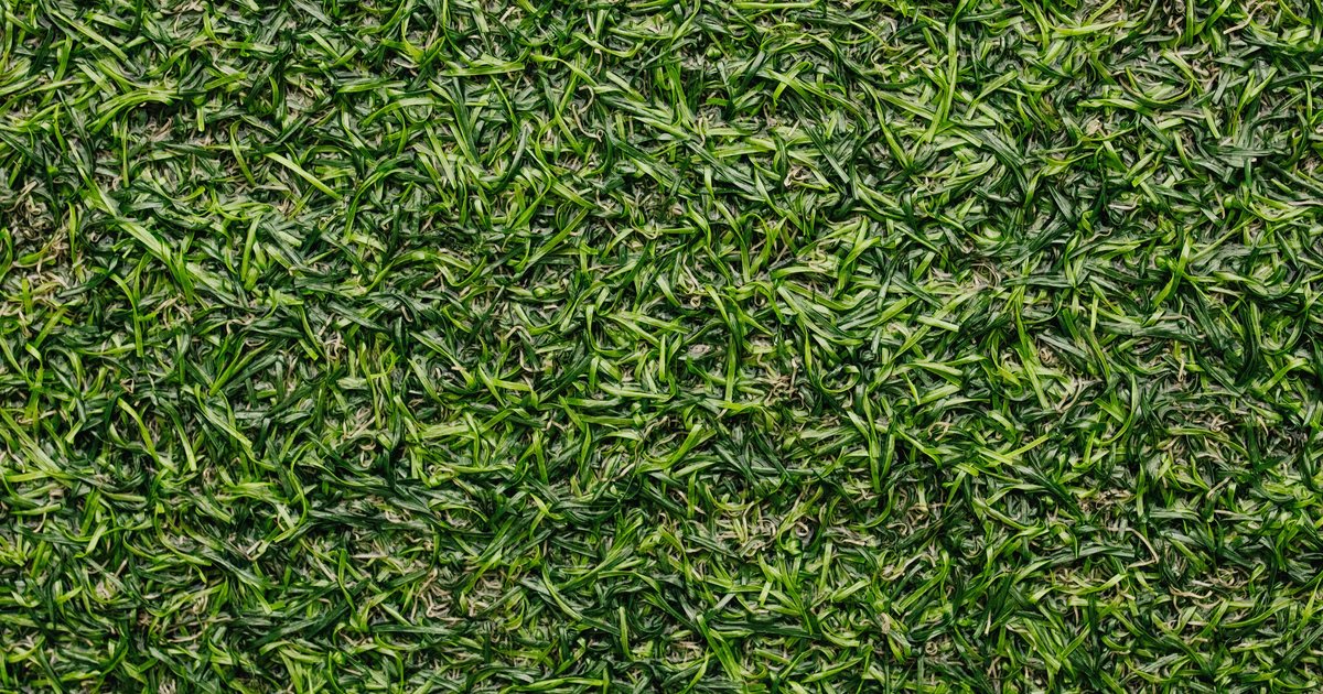 Close-up top-down view of dense green artificial turf blades